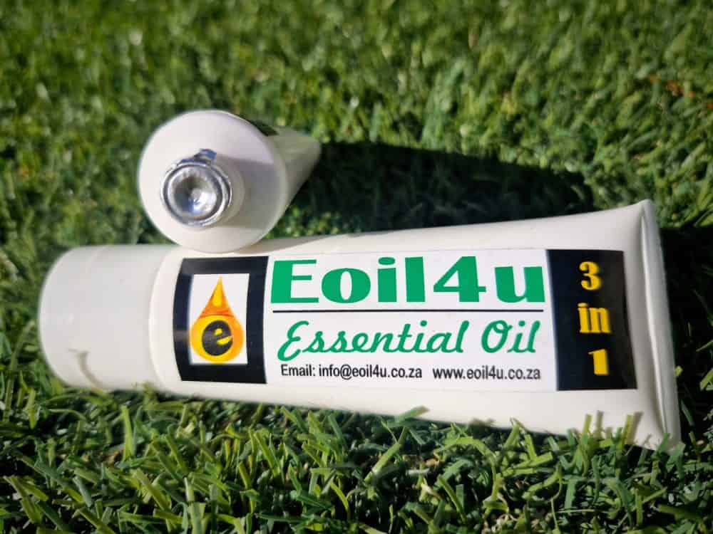 Premium essential oil on green grass, eco friendly product, natural oil, high quality essential oil, Eoil4u brand, environmentally conscious oil 